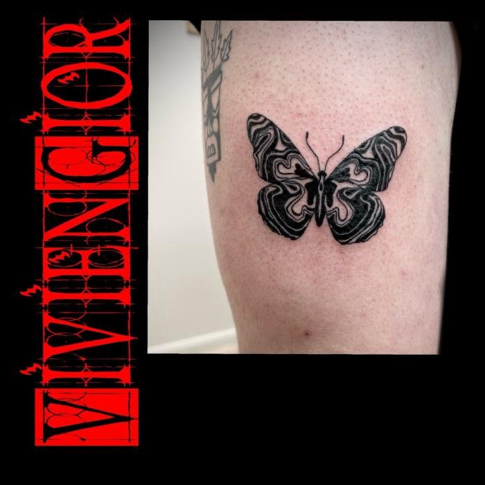  realistic tattoo of butterfly on hand of woman in realism