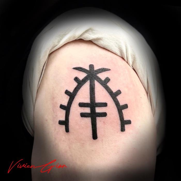  tattoo of symbol tattoo on shoulder